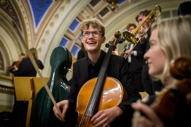 Several musicians waiting for the concert to start. Photo.