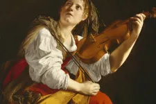 Målning på en kvinna med violin. Foto.
